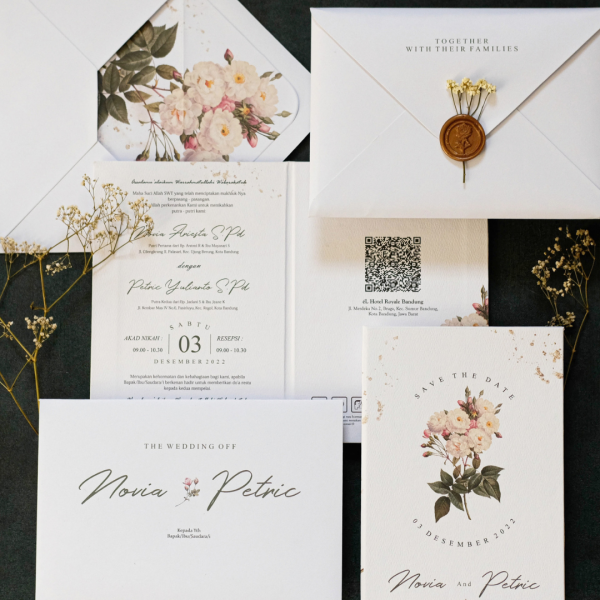 Roselle wedding invitation suite featuring elegant serif typography, soft tonal palette, layered detail cards, and refined envelope presentation.